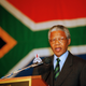 Nelson Mandela before the new South African flag in Johannesburg in 1994.